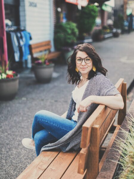 Dr. Amanda Davis, DPT, PRPC sitting on bench