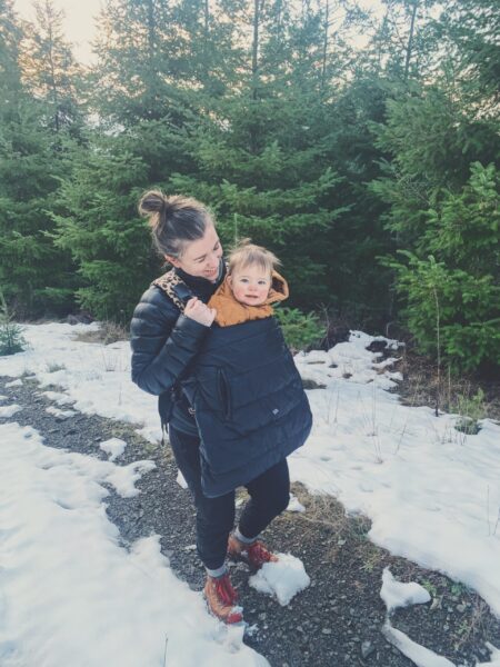 Dr. Amanda Davis, pelvic rehab therapist, with baby in snow