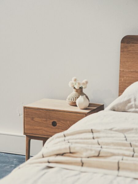 White bedroom with nightstand