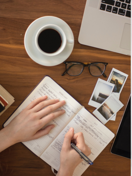 person writing to prepare for the new year