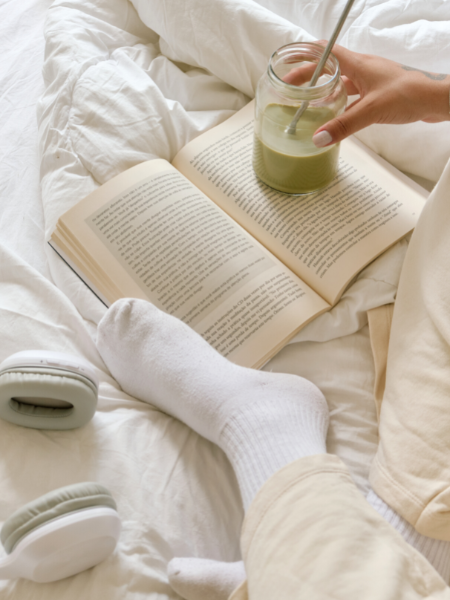 white socks on bed with book