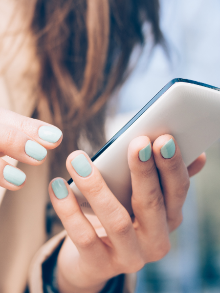woman holding cell phone