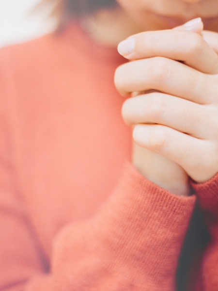 woman’s hands praying