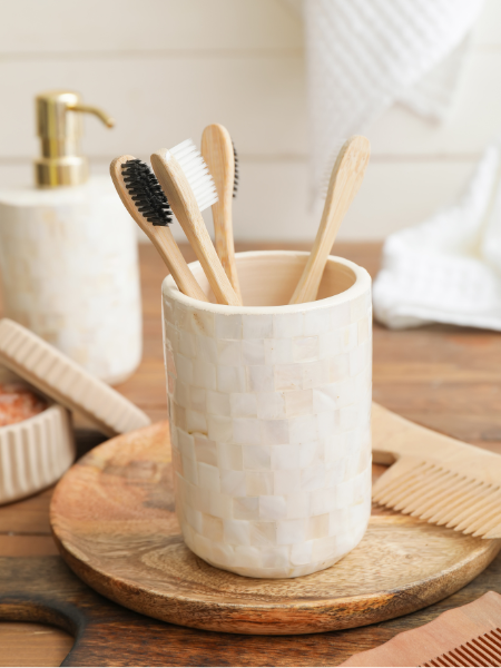 wooden tooth brushes in white holder