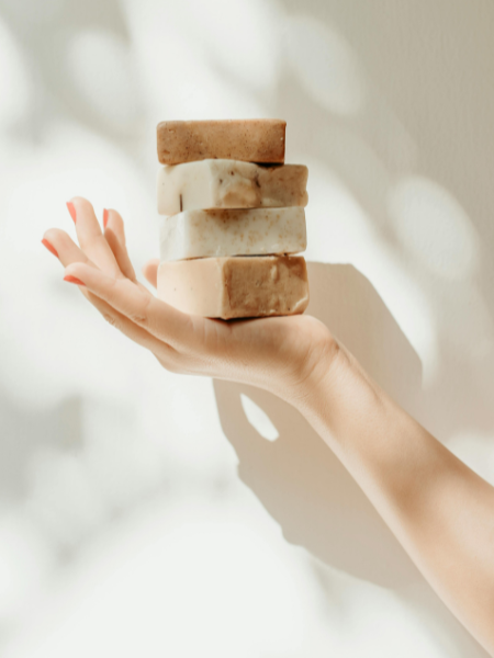 hand holding soap for the perfect bath